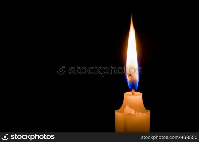 One candle is burning bright on a dark background.
