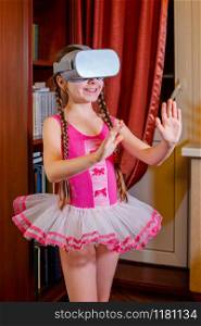 One Caucasian Girl plays virtual reality, the role of the child is played by a dancer, a ballerina. Early development of the child, ideas for the game.. One Caucasian Girl plays virtual reality, the role of the child is played by a dancer, a ballerina.