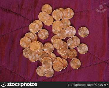 One Cent Dollar coins, United States over red velvet. One Cent Dollar coins money (USD), currency of United States over crimson red velvet background
