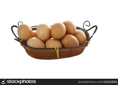 One dozen organic eggs in basket on white background