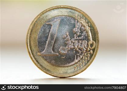One euro coin isolated on blurry background