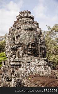 One face in the a small tower in the Bayon Temple in the Angkor Thom complex in Cambodia. The temple has over 136 of these faces carved into the towers.