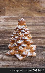 one gingerbread christmas tree on wooden background