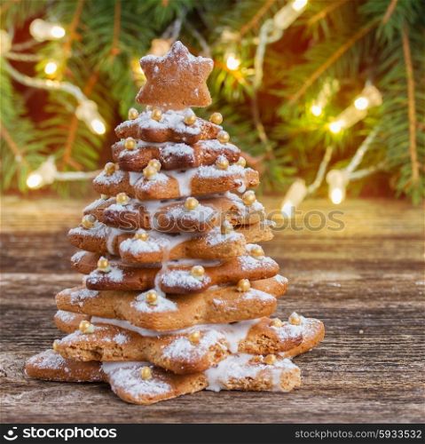 one gingerbread tree with christmas lights in background