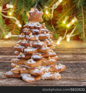 one gingerbread tree with christmas lights in background