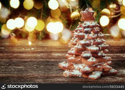 one gingerbread tree with christmas lights in background, retro toned