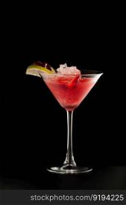 one glass beaker with a drink pomegranate and citrus on a dark background. beverages on a dark background