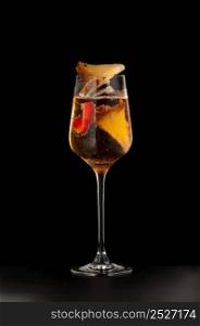 one glass beaker with a fruity drink on a dark background. beverages on a dark background