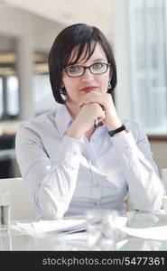 one happy young business woman working on laptop computer at group team meeting at modern office