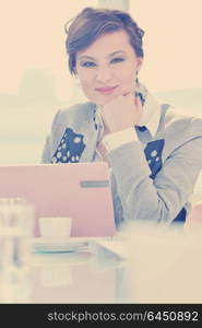 one happy young business woman working on laptop computer at group team meeting at modern office