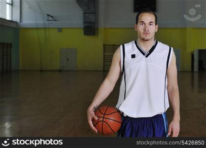one healthy young man play basketball game in school gym indoor relax