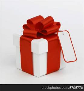 One Holiday gift with tag on white background