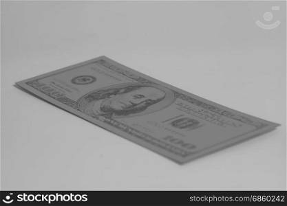 One hundred dollar banknote on gray background.