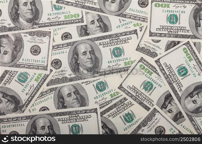One hundred dollar bills pile background texture