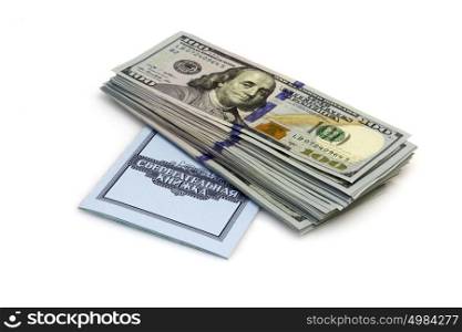 One hundred dollars banknotes lie on checkbook isolated on white background