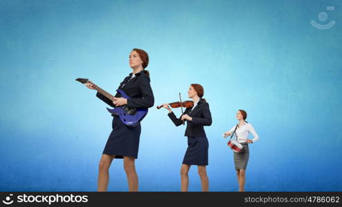 One man band. Young woman in suit playing different music instruments