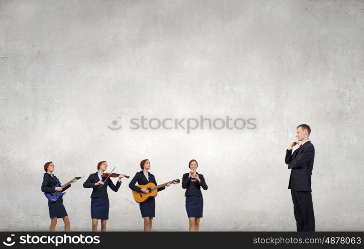 One man band. Young woman in suit playing different music instruments