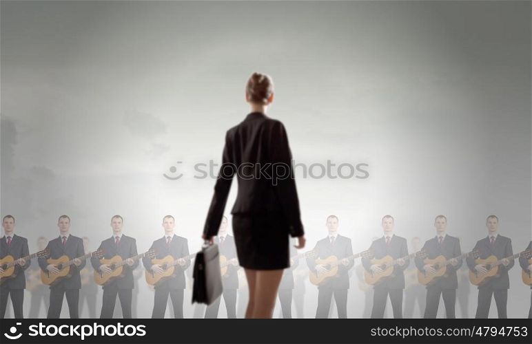 One man band. Young woman with book and playing different music instruments