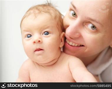 One month old newborn baby with his mother