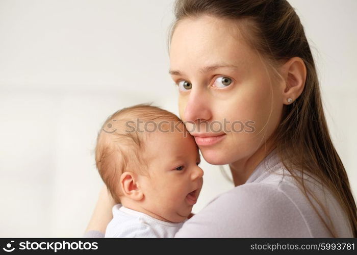 One month old newborn baby with his mother