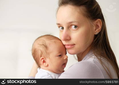 One month old newborn baby with his mother