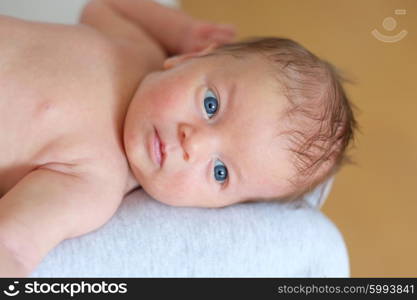 One month old newborn baby with his mother