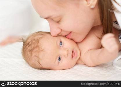 One month old newborn baby with his mother