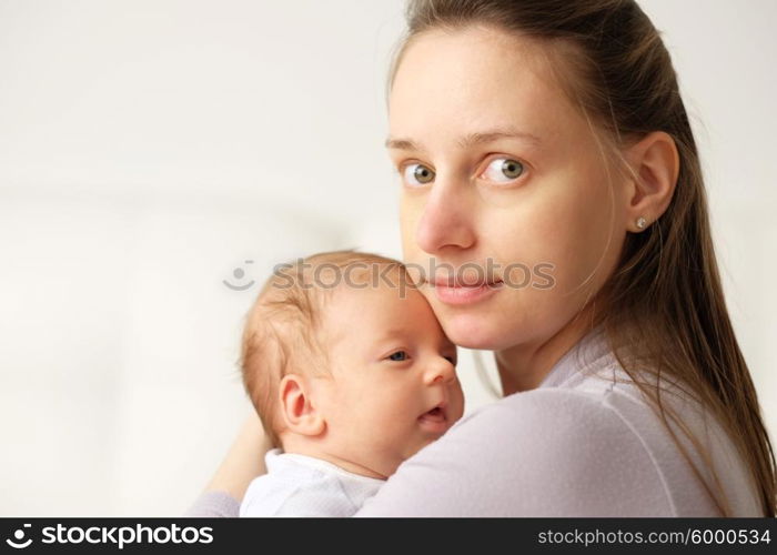 One month old newborn baby with his mother