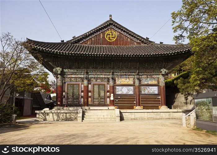 One of the buildings at the Bongeunsa Buddhist temple in Seoul, South Korea. It&rsquo;s a traditional building made of wood and is highly decorated with bright paint colors.