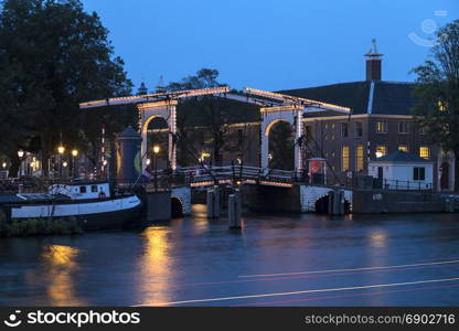 One of the many bridges in the city of Amsterdam in the Netherlands. This is a bascule bridge made of wood.