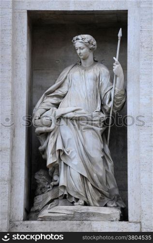 One of the statues on the Palazzo Poli in Rome, Italy
