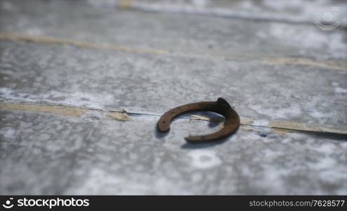 one old rusty metal horseshoe