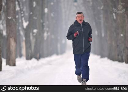 one older man running at alley on winter seasson at early morning