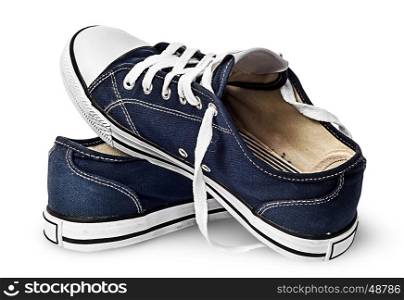 One pair of dark blue sports shoes on one another isolated on white background