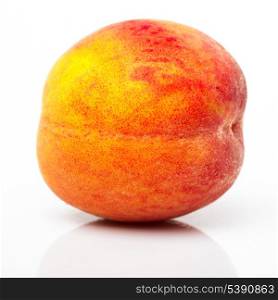 One peach closeup isolated on white background