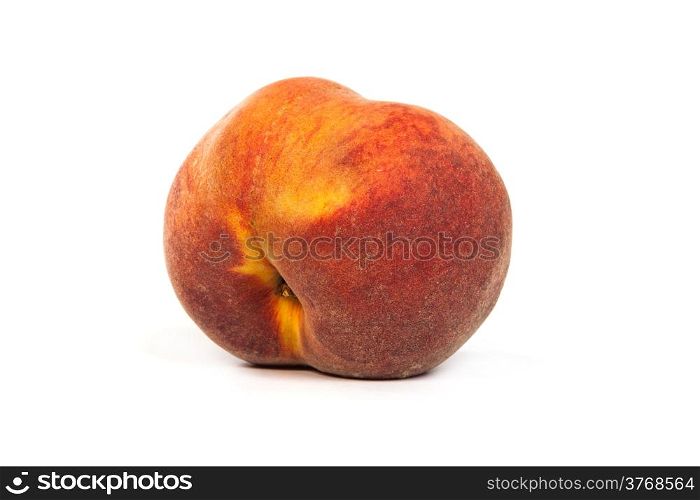 One perfect, ripe peache isolated on a white background.