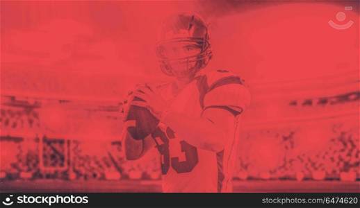 one quarterback american football player throwing ball on big modern stadium field with lights and flares. american football player throwing ball