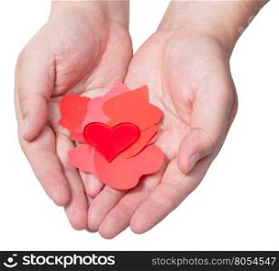 one red heart above pile of paper hearts on male palms isolated on white background