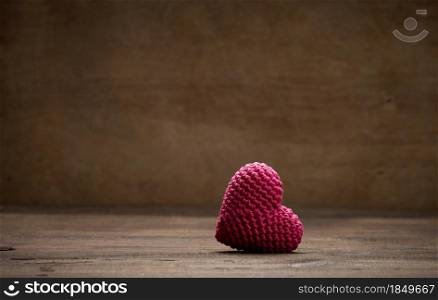 one red heart on a brown background, copy space, Valentine&rsquo;s Day