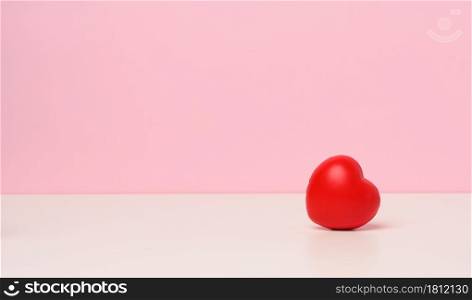 one red heart on a pink background, copy space, Valentine&rsquo;s Day