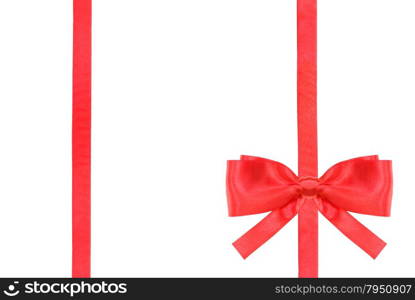 one red satin bow in lower right corner and two vertical ribbons isolated on horizontal white background