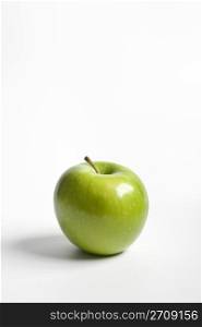 One single green Granny Smith apple