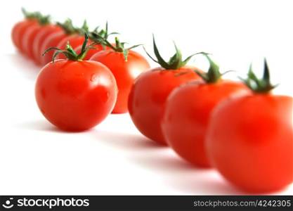 one step forward by one tomato, isolated on white