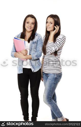 one student calling by phone near her friend with notepads. one student calling by phone near her friend with notepads on white background