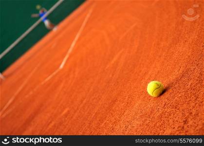 One tennis ball dropped on court