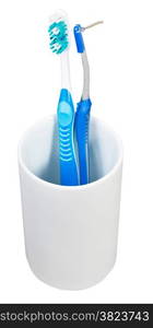 one tooth brush and interdental brush in ceramic glass isolated on white background