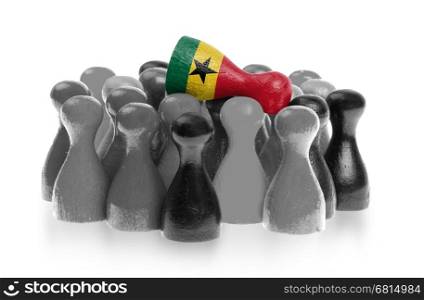 One unique pawn on top of common pawns, flag of Ghana