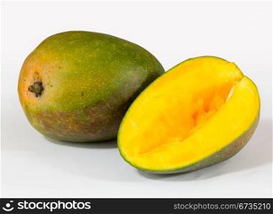 One whole round mangoes or mango on white background