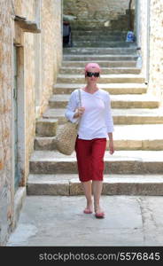 one woman walking on street at old city