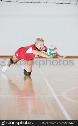 one young girl playing volleyball game sport indoor